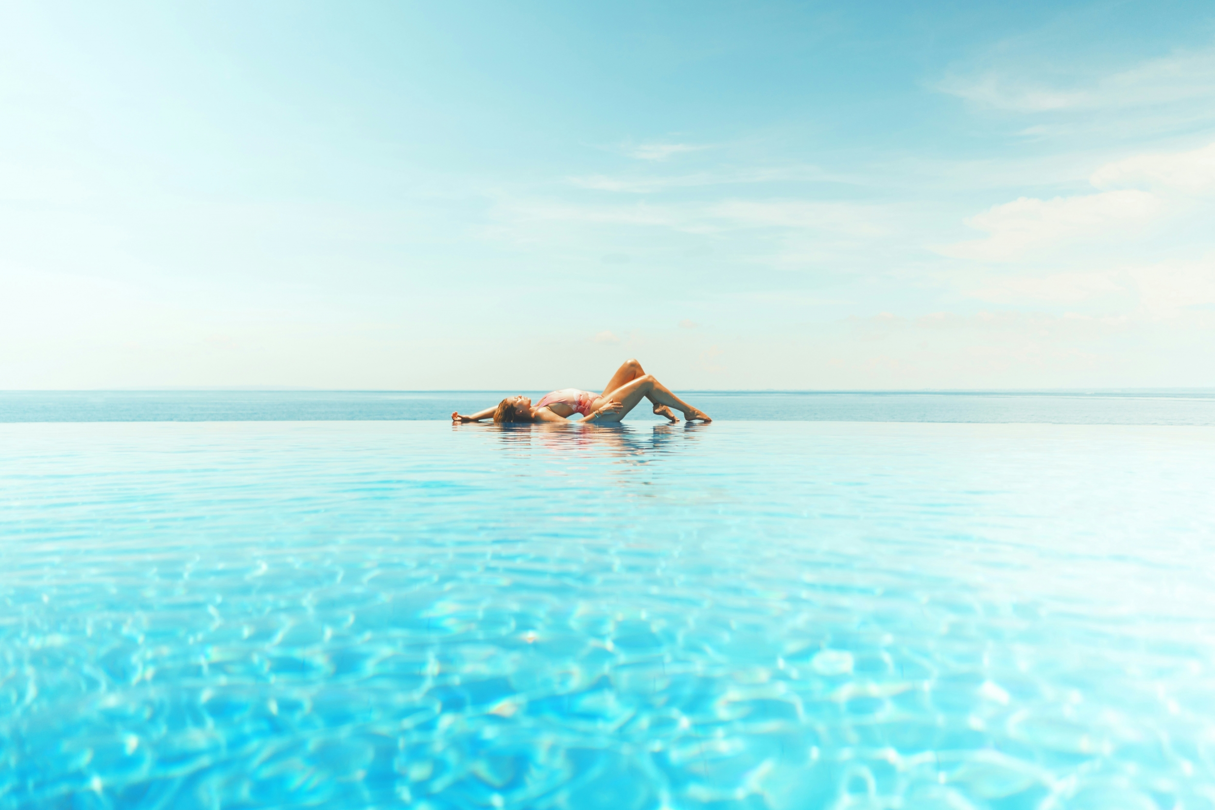 Woman Sunbathing Sexy Blue Water Blue Sky Poolside wallpaper for Apple iPhone, Apple Watch, Mac, iPad and Apple Watch