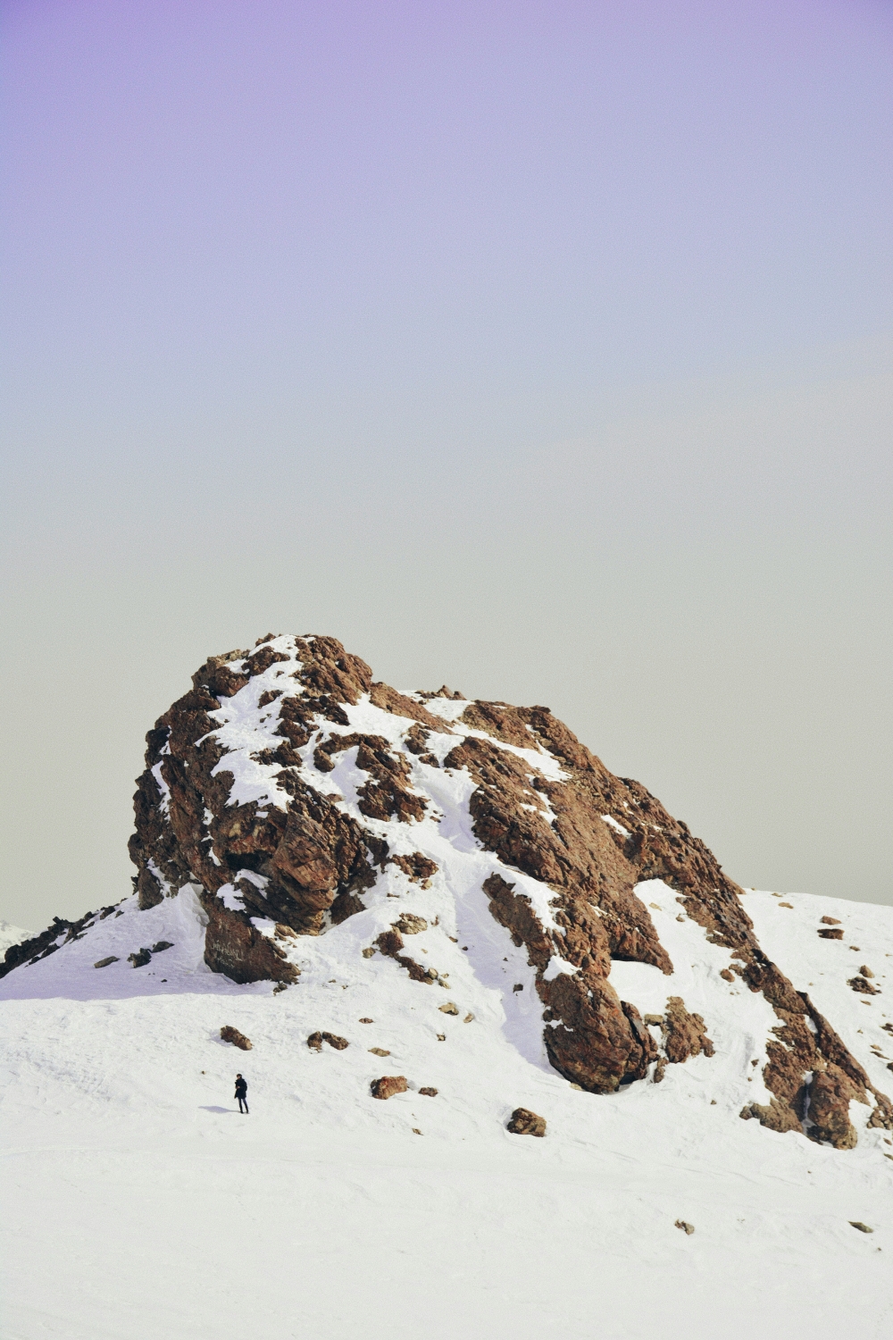 White Snow Lonely Man Walks Up Mountain